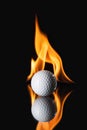 Golf ball on black background with fire Royalty Free Stock Photo