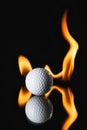 Golf ball on black background with fire Royalty Free Stock Photo