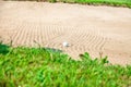 Golf ball on a bunker at Zlati Gric a golf course in Slovenia