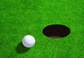 Golf Ball Close to Hole With Copy Space Royalty Free Stock Photo