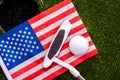 Golf ball and Golf Club on Artificial Grass and USA flag Royalty Free Stock Photo