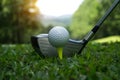 Golf ball and golf club in beautiful golf course with sunset bac Royalty Free Stock Photo