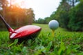 Golf ball and golf club in the beautiful golf course in Thailand. Collection of golf equipment resting on green grass with green Royalty Free Stock Photo