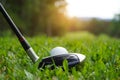 Golf ball and golf club in beautiful golf course at Thailand. Collection of golf equipment resting on green grass with green Royalty Free Stock Photo