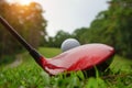 Golf ball and golf club in beautiful golf course at Thailand. Collection of golf equipment resting on green grass with green Royalty Free Stock Photo