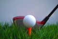 Golf ball and golf club in beautiful golf course at Thailand. Collection of golf equipment resting on green grass with green Royalty Free Stock Photo
