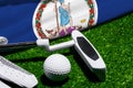 Golf ball and club with flag of Virginia on green grass. Golf championship in Virginia