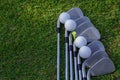 Golf ball and golf club on green grass background Royalty Free Stock Photo