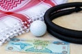 Golf Ball, Dirham Banknote, and Traditional Arab Male Clothes - kaffiyah and agal Royalty Free Stock Photo