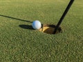 Golf Ball On Edge of Hole Royalty Free Stock Photo