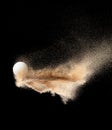 Golf ball explode from sand bunker. Golfer hit ball sand explosion in mid air. Golf club hit ball tee in sand bunker explosion. Royalty Free Stock Photo