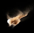 Golf ball explode from sand bunker. Golfer hit ball sand explosion in mid air. Golf club hit ball tee in sand bunker explosion. Royalty Free Stock Photo