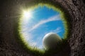 Golf ball is falling into hole. View from inside of hole. 3D rendered illustration. Royalty Free Stock Photo