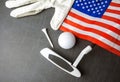 Golf ball with flag of USA on wood table