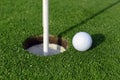 Golf ball and Flagstick of Manicured grass of putting green Royalty Free Stock Photo