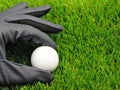 Golf ball and glove Royalty Free Stock Photo