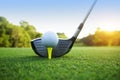 Golf ball and golf club in beautiful golf course with sunset bac Royalty Free Stock Photo