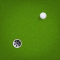 Golf ball and golf hole on green grass background. Vector. Royalty Free Stock Photo