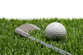 Golf ball and golf club on grass in white background Royalty Free Stock Photo