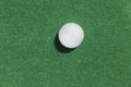 golf ball on green background, top view Royalty Free Stock Photo