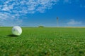 Golf ball on the green course. Sport playground for golf club with landscape Royalty Free Stock Photo