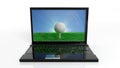 Golf ball on green field with blue sky on screen of a laptop Royalty Free Stock Photo