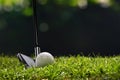 Golf ball on green grass ready to be struck on golf course Royalty Free Stock Photo