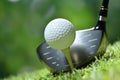 Golf ball on green grass ready to be struck on golf course Royalty Free Stock Photo