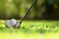 Golf ball on green grass ready to be struck on golf course background Royalty Free Stock Photo