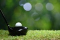 Golf ball on green grass ready to be struck on golf course Royalty Free Stock Photo