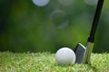 Golf ball on green grass ready to be struck on golf course Royalty Free Stock Photo