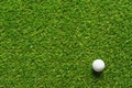 Golf ball on green grass texture of golf course for background. Royalty Free Stock Photo