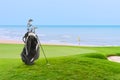 Golf bag and Golf Accessories Golf Set at golf course blue sea and blue sky as background Royalty Free Stock Photo