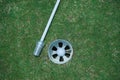 Golf ball is beside the hole. Golf ball on the edge of hole on the green grass Royalty Free Stock Photo