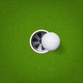 Golf ball and golf hole on green grass background. Vector. Royalty Free Stock Photo