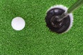 Golf ball and hole Royalty Free Stock Photo