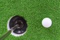 Golf ball and hole Royalty Free Stock Photo