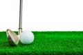 Golf ball and iron on artificial green grass Royalty Free Stock Photo