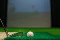 Golf Ball and Iron Club on Artificial Turf in Indoor Golf Simulator for Training or Practice Royalty Free Stock Photo