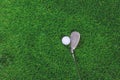 Golf ball and iron club on grass Royalty Free Stock Photo