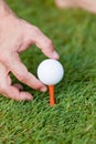 Golf ball and iron on green grass detail macro Royalty Free Stock Photo