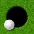 Golf ball on lip of cup Royalty Free Stock Photo