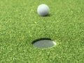 Golf ball on lip of cup of lovely beautiful golf course Royalty Free Stock Photo