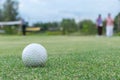 Golf ball lip of hole on green Royalty Free Stock Photo