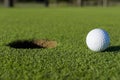 Golf Ball Near Hole Royalty Free Stock Photo