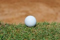 golf ball near sand bunker Royalty Free Stock Photo