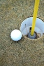 Golf Ball next to hole Royalty Free Stock Photo