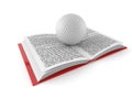 Golf ball on open book