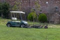 Golf ball picker cart at the driving range Royalty Free Stock Photo