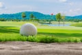 Golf ball on sand bunker in golf courses Royalty Free Stock Photo